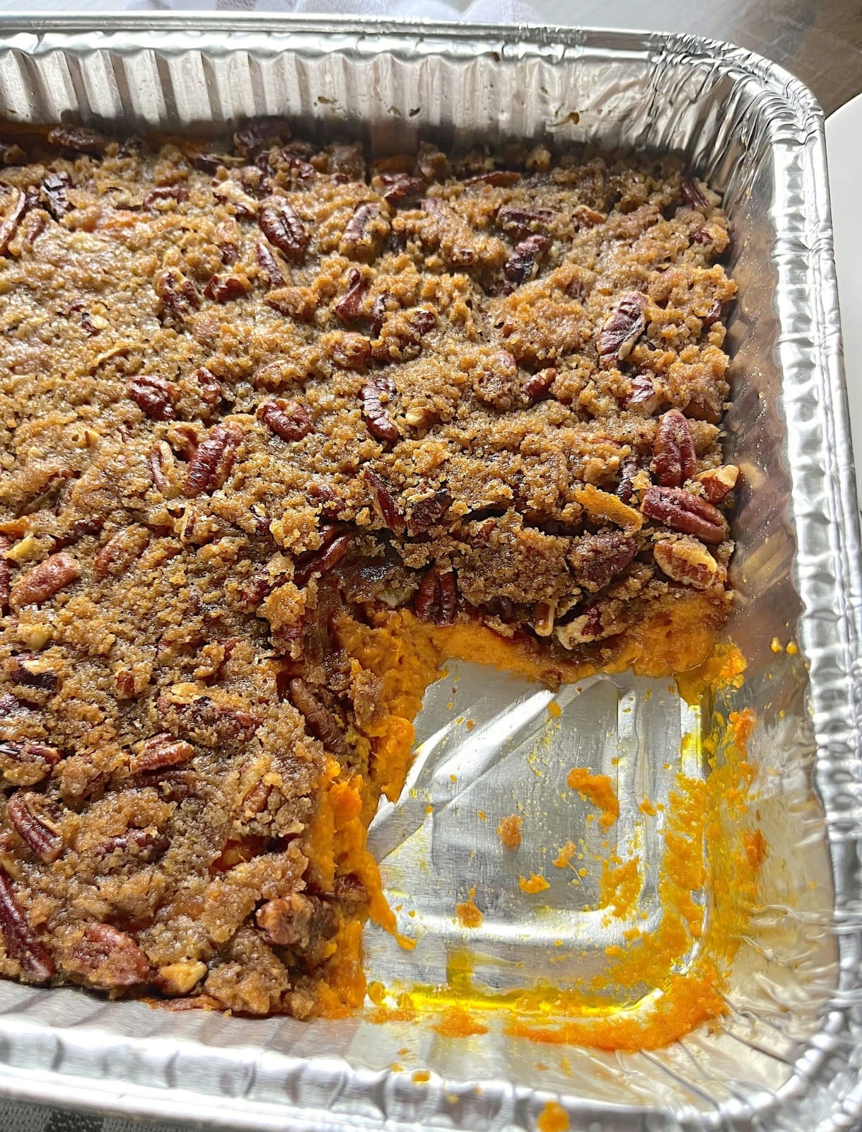 A delicious, golden-brown Southern sweet potato casserole topped with crispy pecans.